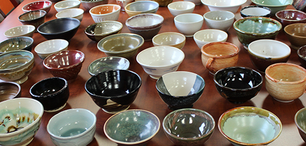 A table full of hand-made bowls at Food Bank's Empty Bowl event.