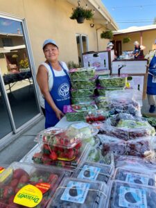 A St. Vincent de Paul Volunteer prepares to distribute rescued produce.