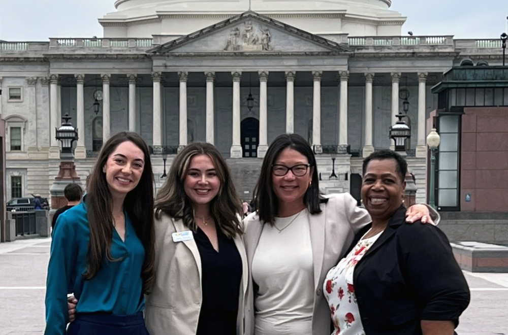 Advocacy employees and volunteers outside capital building.