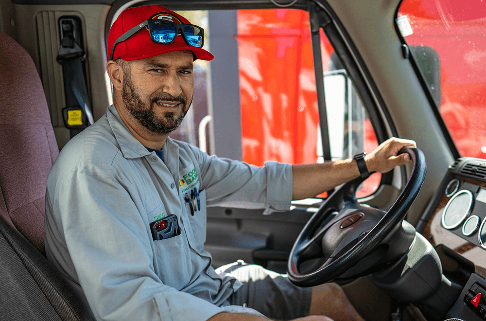 Food Bank Driver sitting in a vehicle.