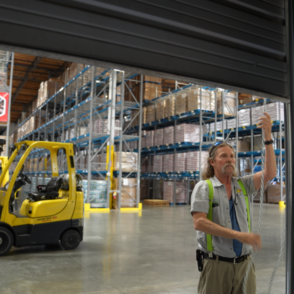A staff member works in our Food Bank warehouse.
