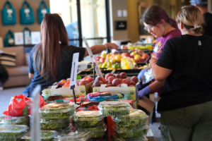 Volunteers set out food on tables at The Bay Church.