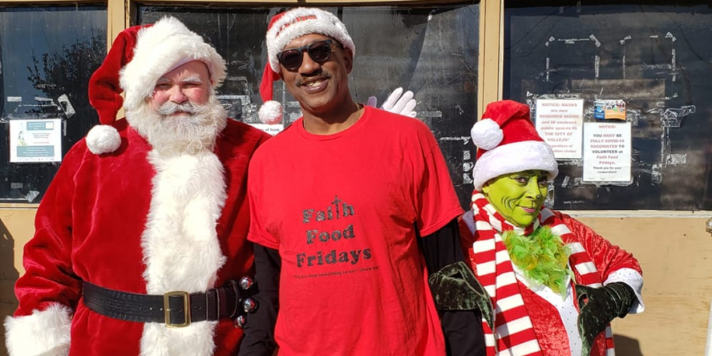 Santa, Faith Food Fridays staff member and The Grinch