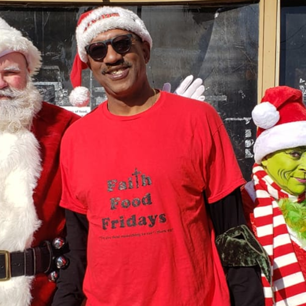 Santa, Faith Food Fridays staff member and The Grinch