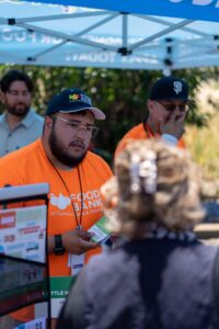 A member of the Food Bank CalFresh Team talks to the public.