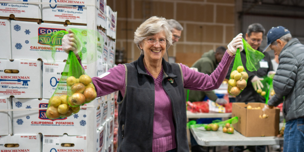 A Food Bank volunteer in our warehouse.