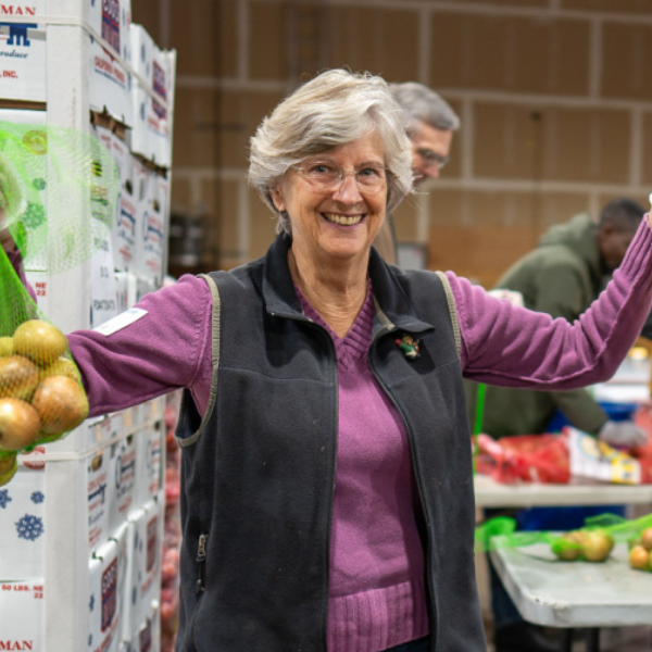 A Food Bank volunteer in our warehouse.