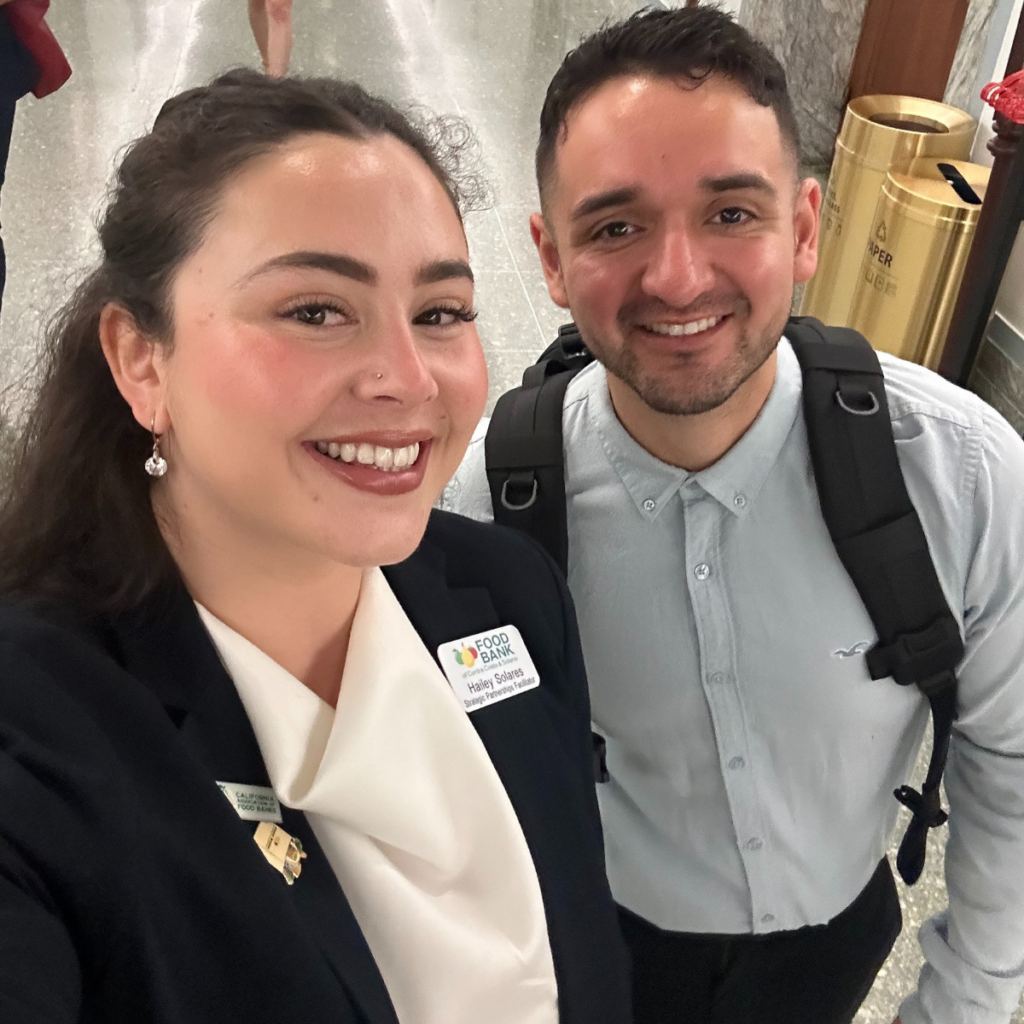 Two Food Bank advocates pose for a selfie.