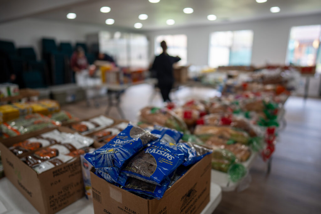 A table filled with bread in a food pantry.