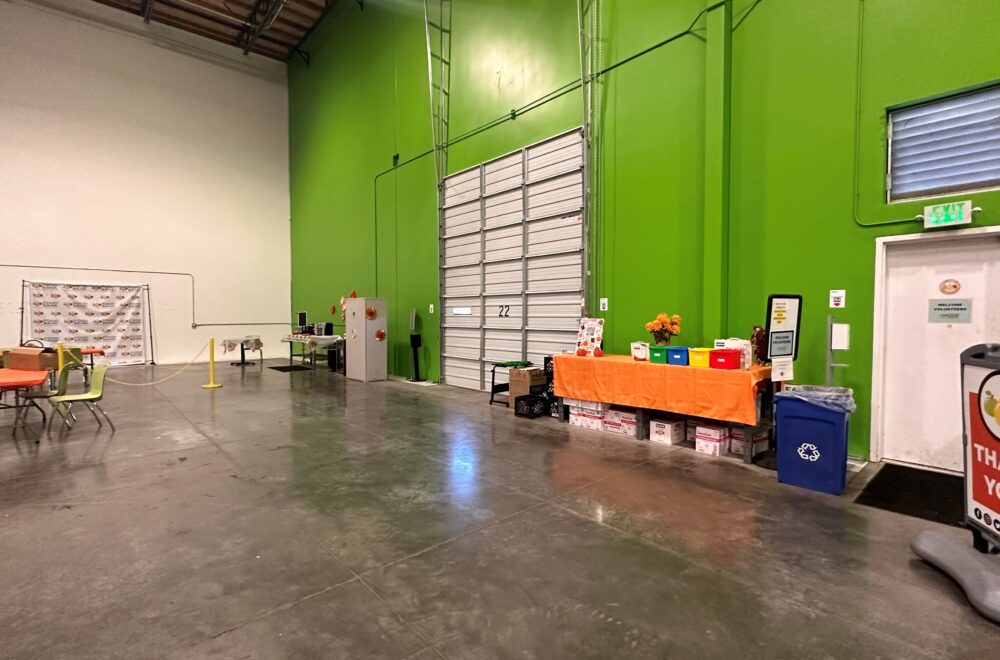 A warehouse with a bright green wall.