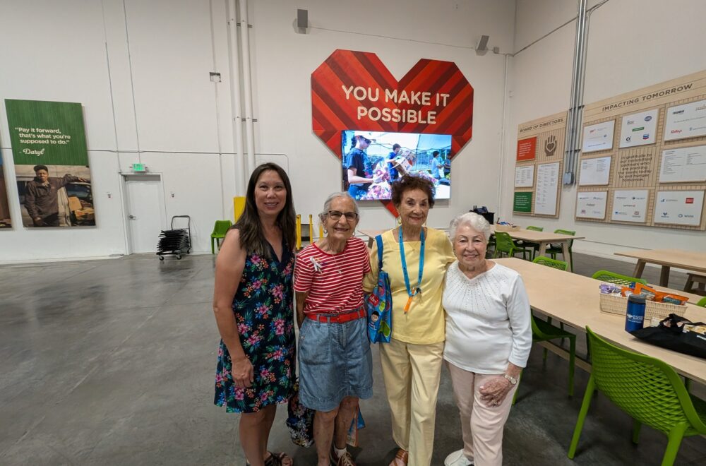 Visitors pose for a photo in the volunteer center.
