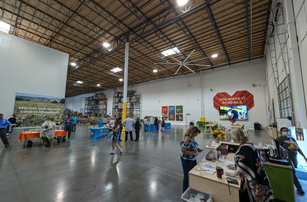 A wide shot of our updated warehouse with painted walls and new art.