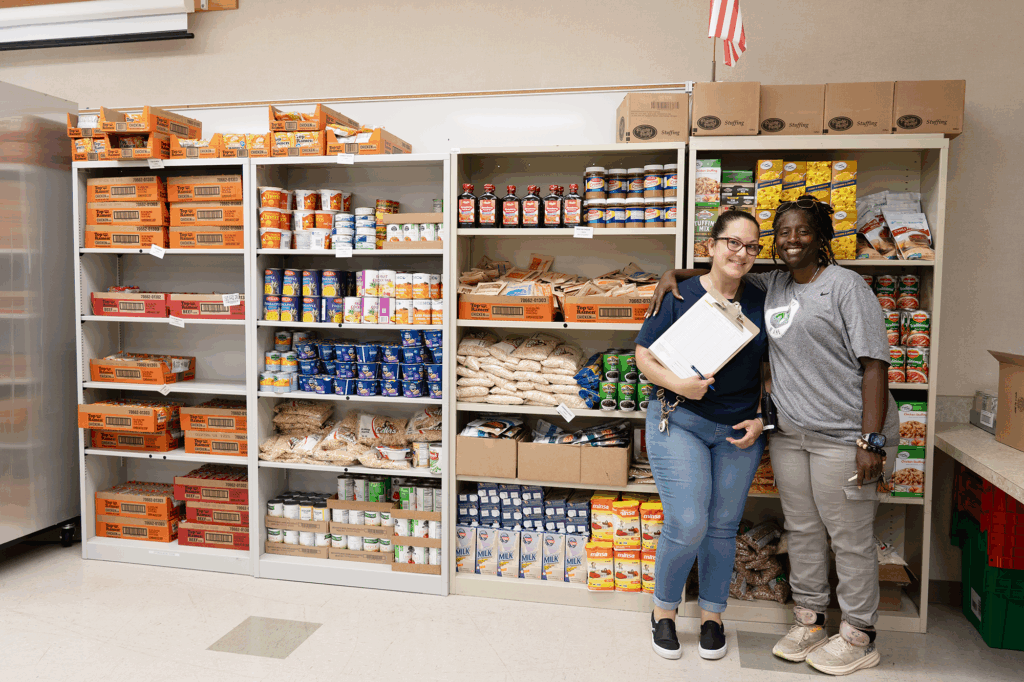 Dixon High staff members stand in the Ram's Vault school food pantry.