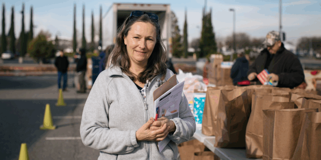 A Food Bank staff member at an emergency distribution.