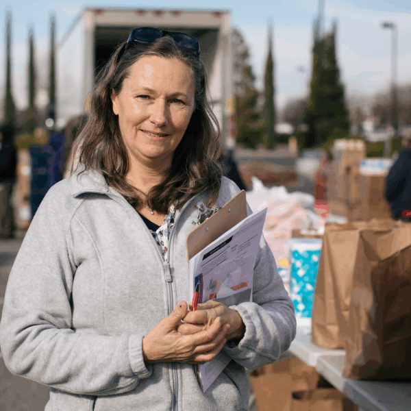 A Food Bank staff member at an emergency distribution.