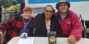 Sue, Pamela, and David at a distribution