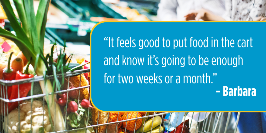 A full grocery cart with a text overlay reading: “It feels good to put food in the cart and know it’s going to be enough for two weeks or a month.” - Barbara